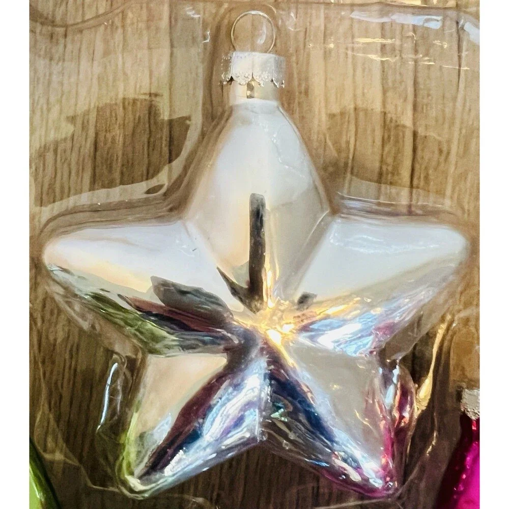 Handcrafted Glass Ornament Set features four star-shaped ornaments metallic